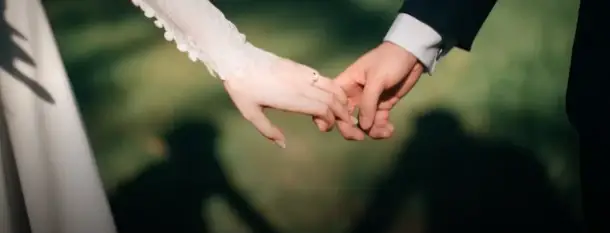 Bride and groom holding hands